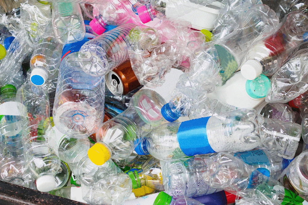 pile of assorted plastic bottles and containers for recycling